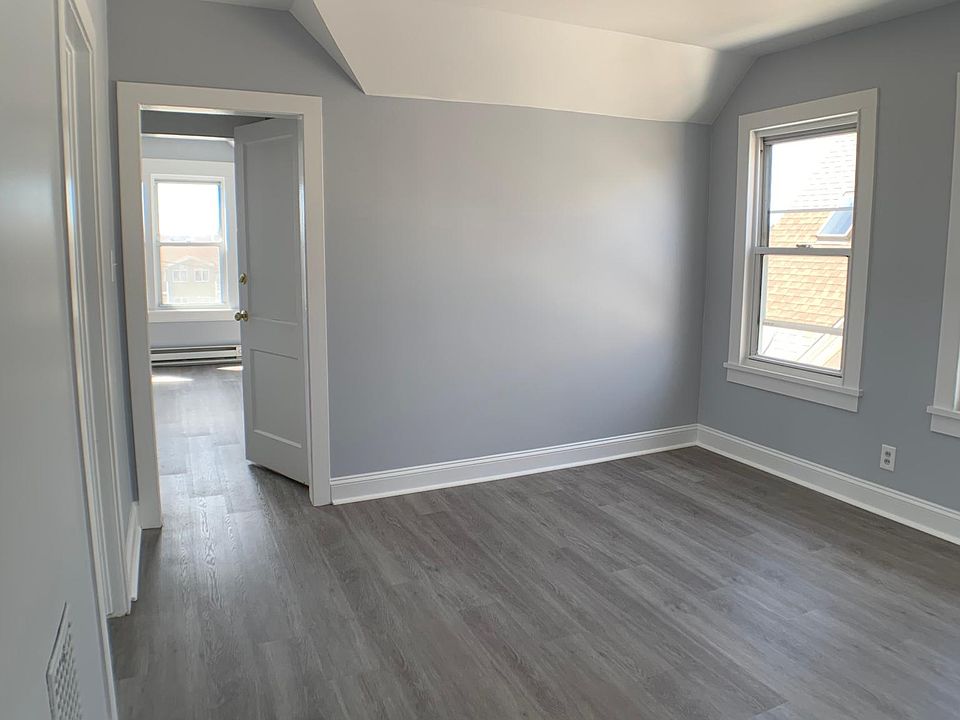 Living Room with excellent natural light and beautiful newly installed Like-wood floors