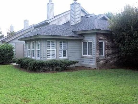 Back & side yard; back patio shielded by sunroom shown here