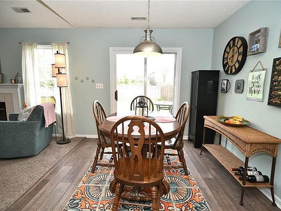 Dining/eat-in area with sliding door to deck.  Check out the new flooring!