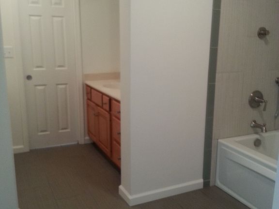 Oversized bathroom attached to bedroom