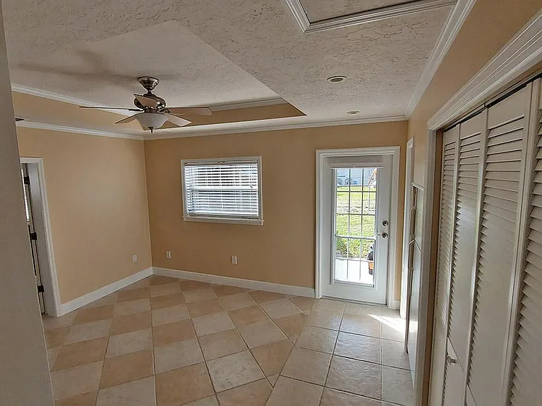 Bonus Room with Laundry Closet, Extra Storage, and Pantry to right. Backdoor to covered patio area