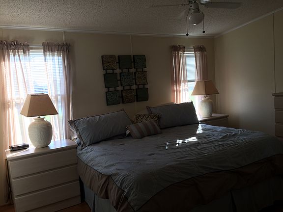 King bed, lake from windows.