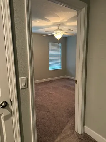upstairs bedroom # 2 - has two windows facing the front of the house. View from hallway