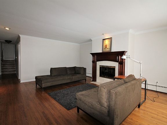 Spacious living room with gas log fireplace.