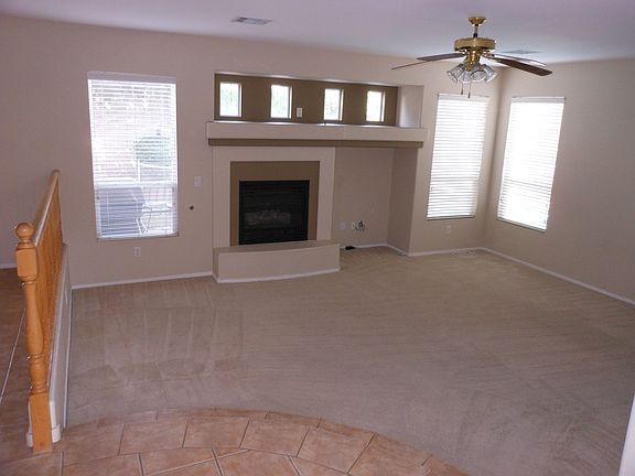Sunken family room adjacent to kitchen and dining nook.