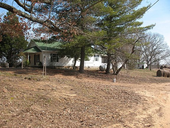 Side of house showing screened back porch