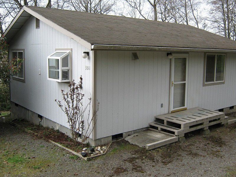 Front of the home showing garden window over kitchen sink.