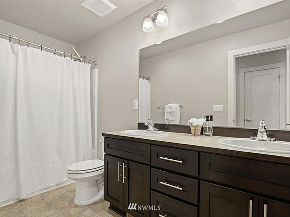 Bathroom with bathtub in second floor