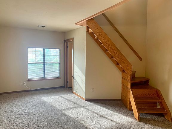 living space, stairs, door to bath