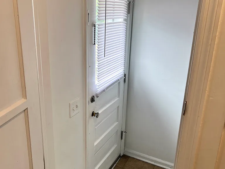 Steps from kitchen to side door to back yard and basement/garage
