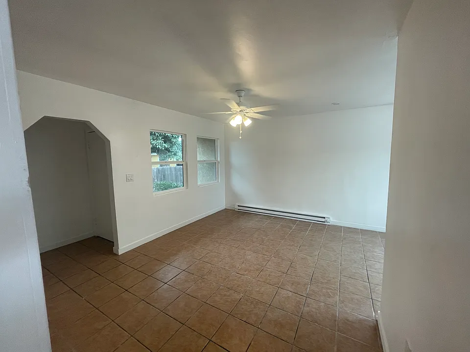 Living Room with Baseboard Electric Heater