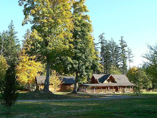Log home with breezway to 24x32 finished garage/office/studio.          
