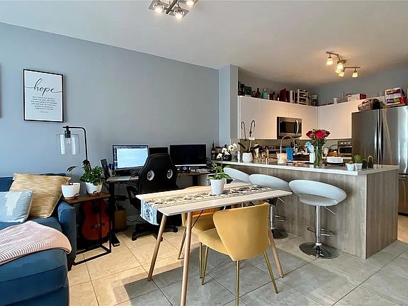 Furnished view of living room and kitchen