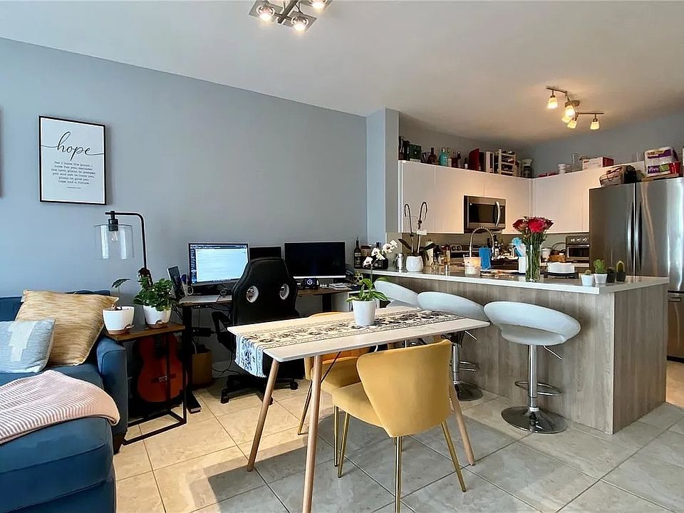 Furnished view of living room and kitchen