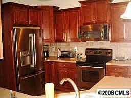 Fully equipped, 42" cabinets, solid surface counters, stainless appliances