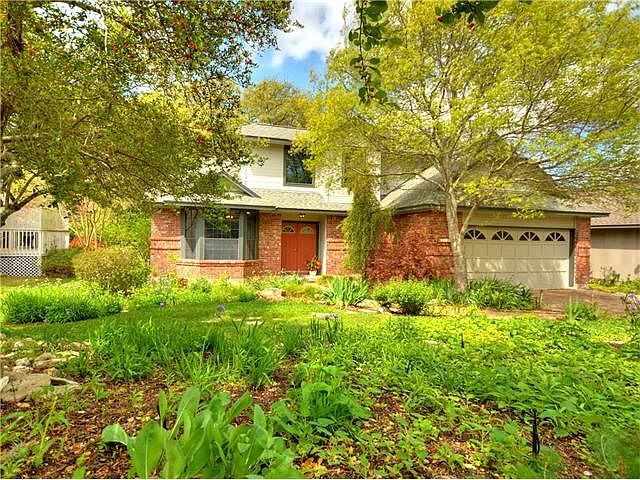 Beautiful, native and natural plants surround this lovely home. Wildlife Habitat award.
