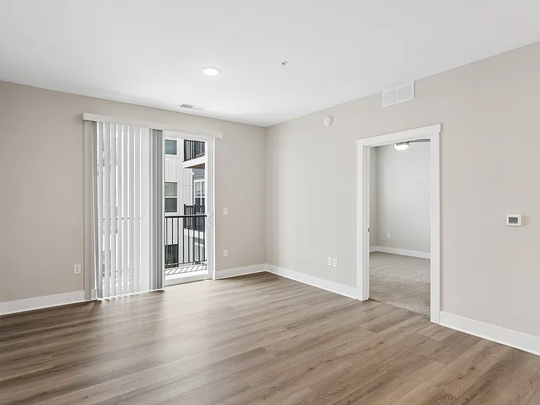 Living area with a patio/balcony of an apartment home at Tiffany Flats in Columbus, OH.
