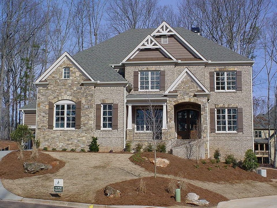 The Vickery by Martin McWhorter Custom Homes is 3 sides brick w/ 3 car garage 