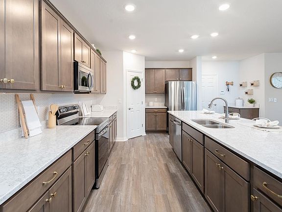 Your spacious new kitchen offers natural lighting, a pantry, and your choice of finishes - Wesley ll