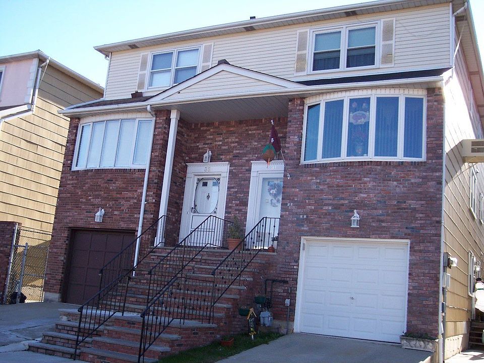 2400 Sq Ft 2 family semi with garage,full basement, and 1 bedroom rental.