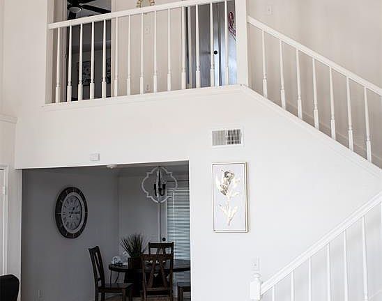 Staircase over looking the living room. Two bedrooms are located on second floor.