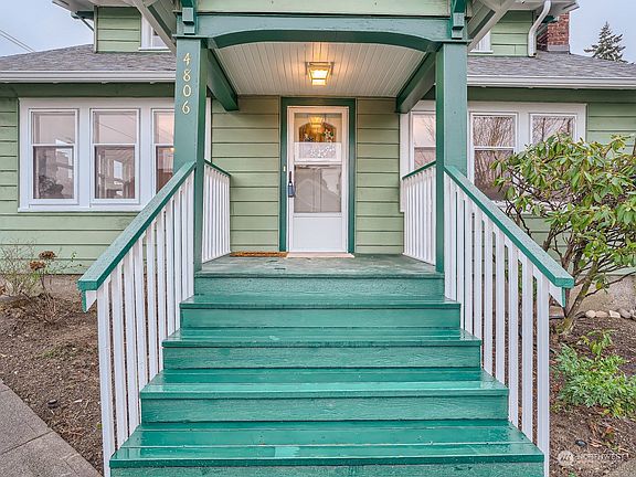 Covered porch are, large enough for a few chairs>