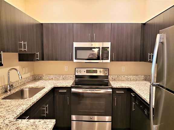Quartz counter tops, stainless steel and updated cabinets make this home a chef's dream come true!