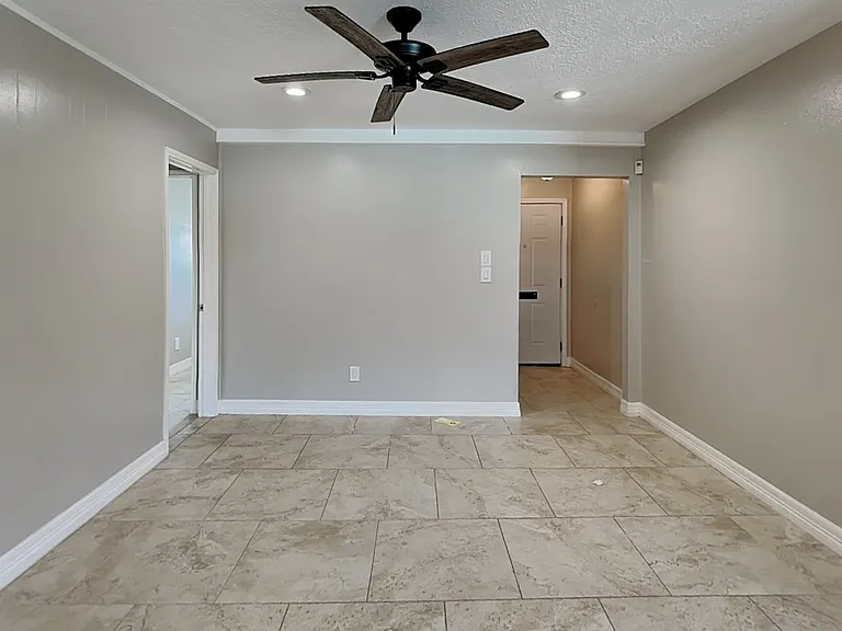 Spacious living area with neut