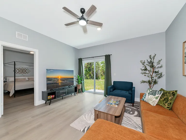 Living Room with 65" TV, great sitting area.