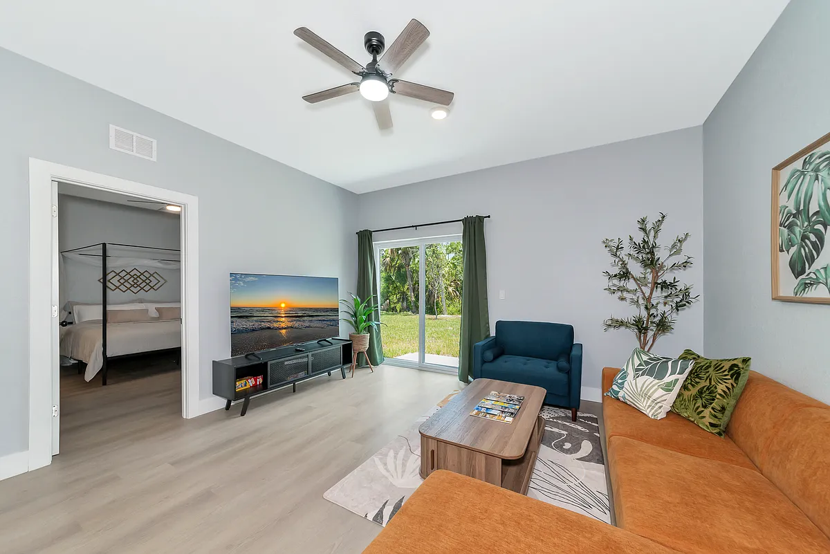 Living Room with 65" TV, great sitting area. - 17148 Carleen Ave