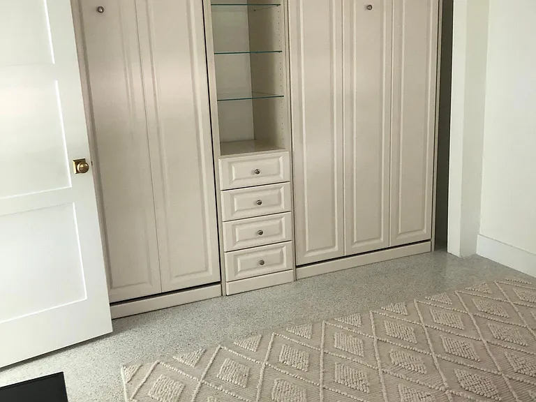 Bedroom en-suite. Two single Murphy beds in closed position.