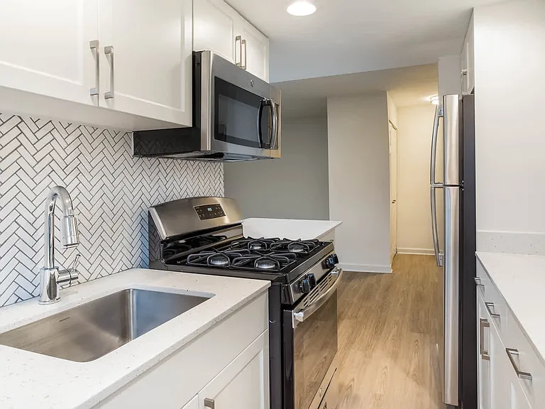 Kitchen with Stainless Steel Appliances and Quartz Countertops