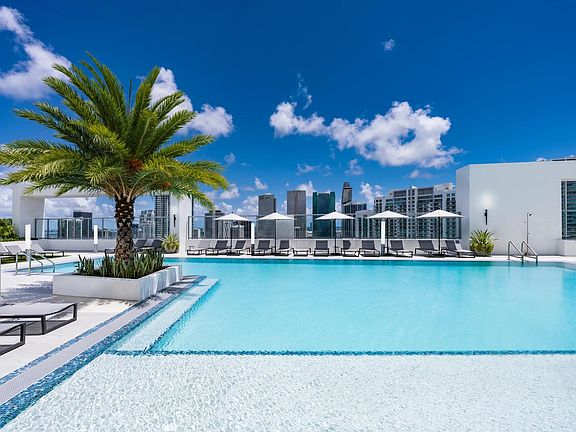 Bask in the sun and skyline views from Modera Riverside's rooftop pool deck.