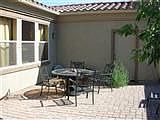 open back patio in fenced yard