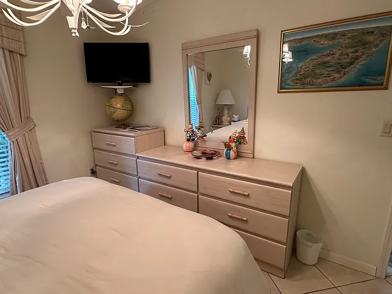 First bedroom - view #2. (Note: all bedrooms have ceiling fans and wall mounted TVs)