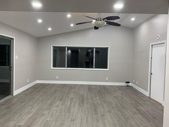 Family room that leads to backyard and office/bedroom