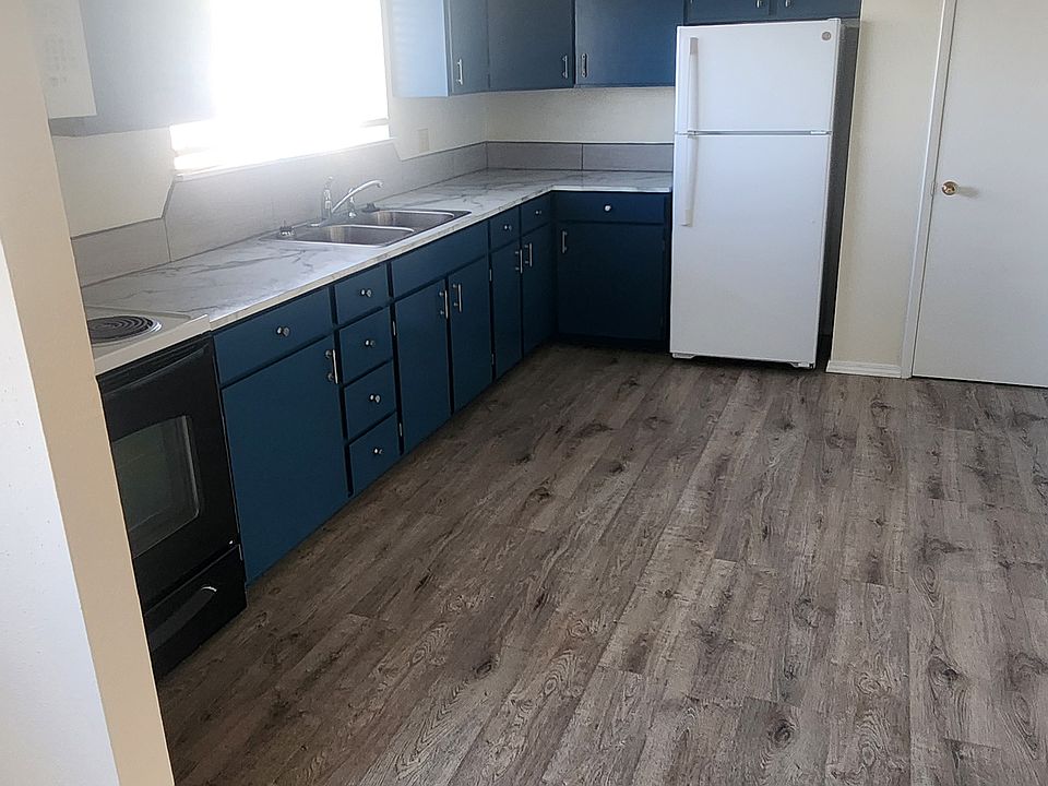 Spacious kitchen with pantry on the side of refrigerator