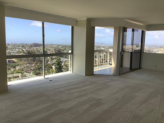 Large open spaces, floor-to-ceiling windows throughout
