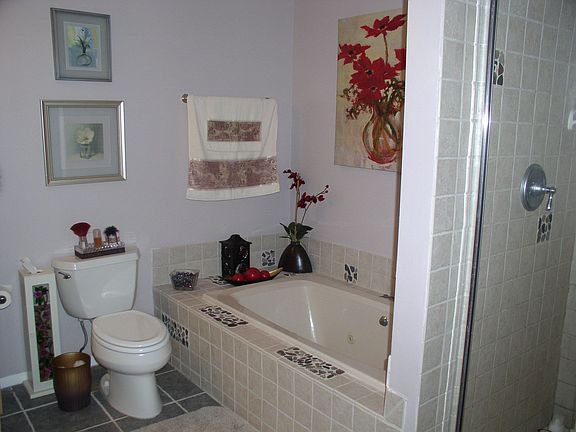 totally renovated master bath with jetted tub, italian tile and stall shower