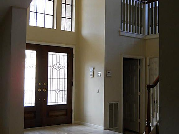  2 story elegant foyer entry. Leaded glass double doors!