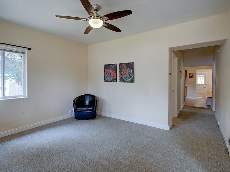 LIVING ROOM LOOKING DOWN HALLWAY TO BEDROOM #2 AND KITCHEN