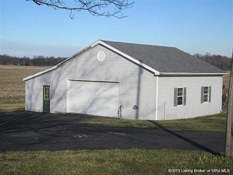 Detached 2 car garage with door leading to work or storage area. Garage has phone line and electric.