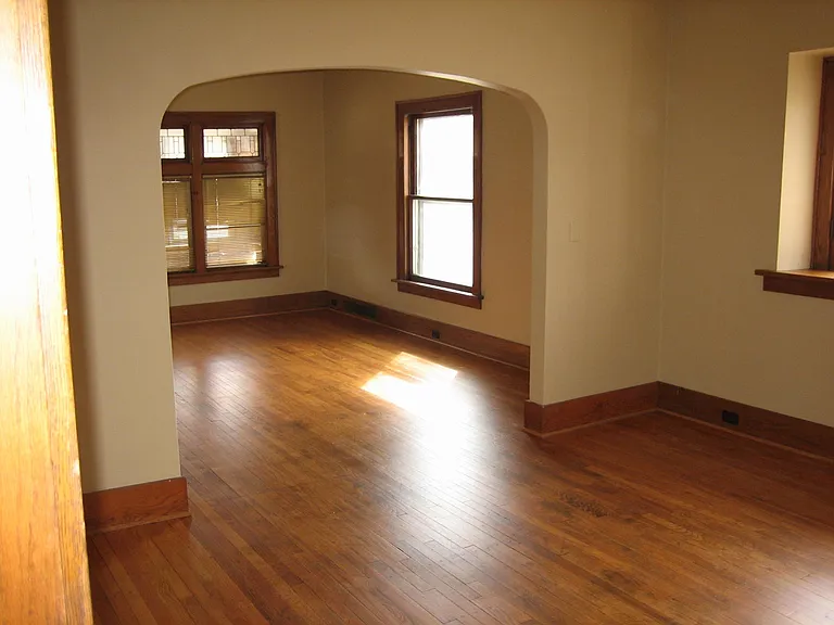 Spacious dining room leading to living room.