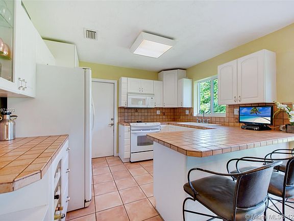 Kitchen has lots of counter space. 