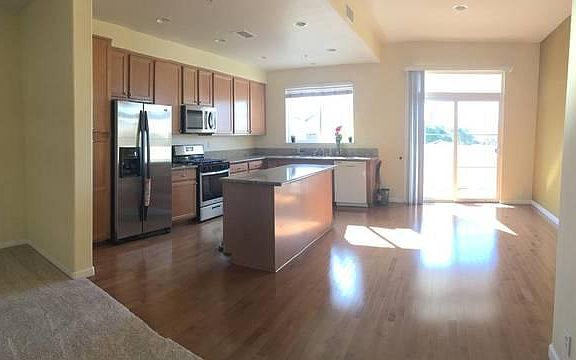 Kitchen with appliances and Patio