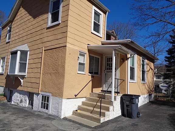 Back covered entrance leads to eat-in kitchen