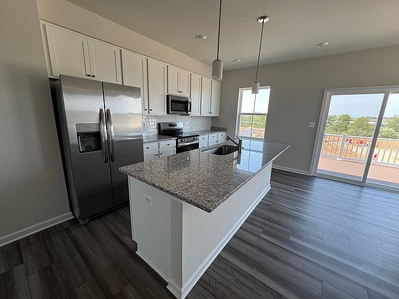 Granite countertop with brand new appliances.