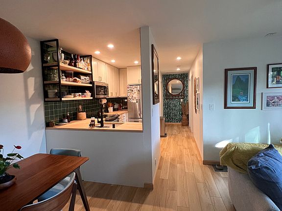Walking down the hallway, you have the fully renovated kitchen on your left follow by laundry and bathroom. On the right side, two spacious bedrooms.