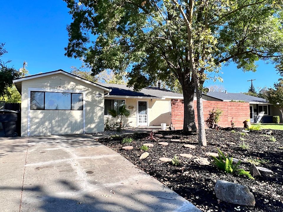 The studio unit is on the left side of the home with a side door entrance