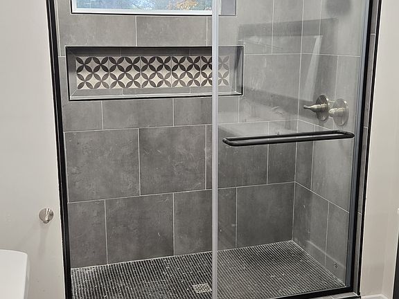 New suite bathroom, double shower heads (one rainhead plus standard), custom tile, sliding glass doors